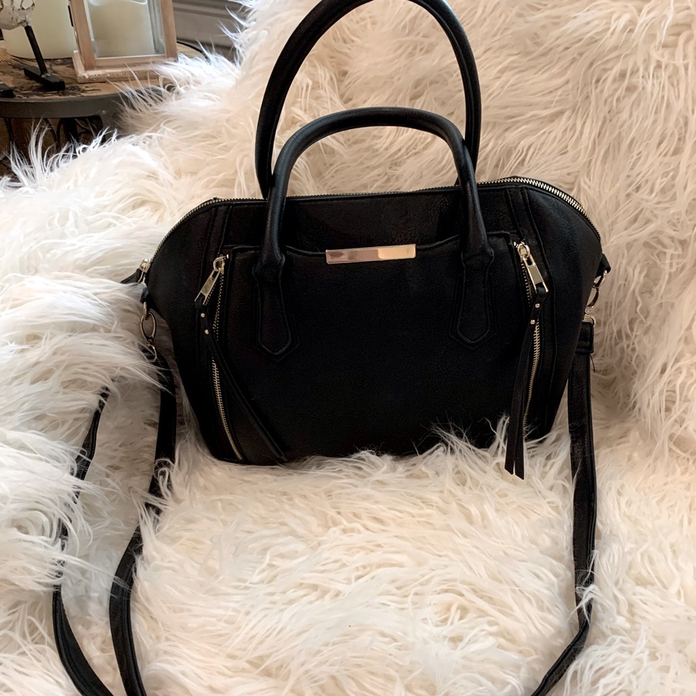 Black leather purse with gold trim.